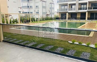 MANAVGAT ILICA'DA HAVUZLU AMERİKAN MUTFAKLI SATILIK 1+1 DAİRE