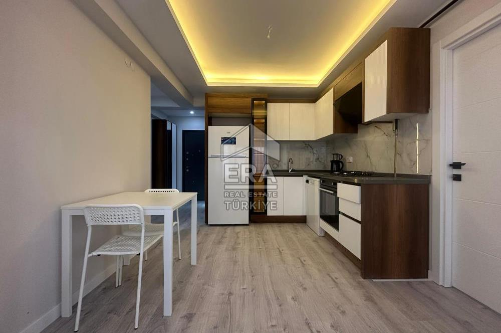 Seyrek Merkezde Full Eşyalı Satılık 1+1 Ara Kat Daire